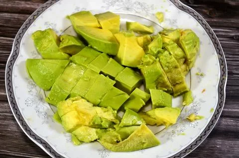 Pieces of avocado, a nutrient dense fruit, botanically a large berry, known.. Stock Photos