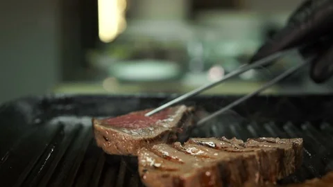 Pieces of beef are fried in a grill pan. Stock Footage 113221453