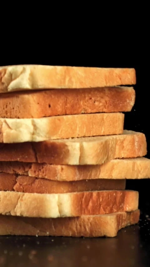 Pieces of bread fall on the table. Filmed on a high-speed camera at 1000 fps Stock Footage 335376766