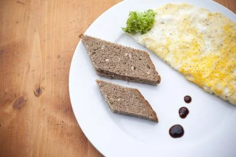 Pieces of bread with omelette Stock Photos