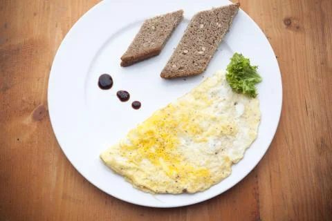 Pieces of bread with omelette Stock Photos