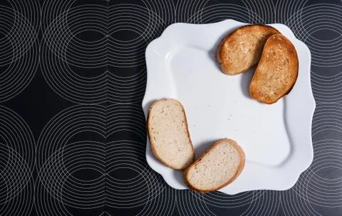 Pieces of bread on a plate Stock Photos