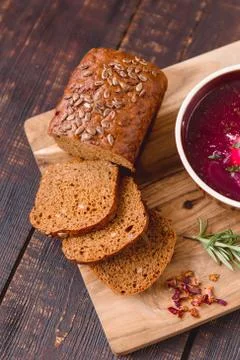 Pieces of bread with seeds on a cutting Board Stock Photos
