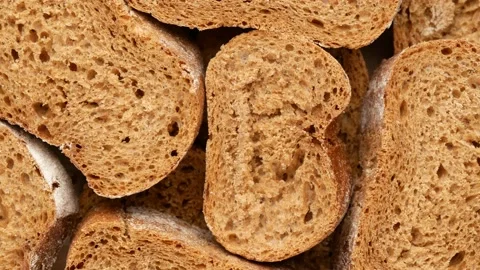 Pieces of bread, top view. Bread covered with flour, dolly shot. Video stock 140974959