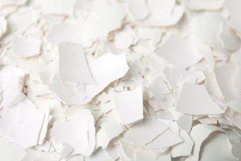 Pieces of broken eggshells as background, closeup Stock Photos