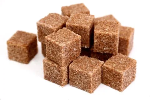Pieces of brown sugar Stock Photos