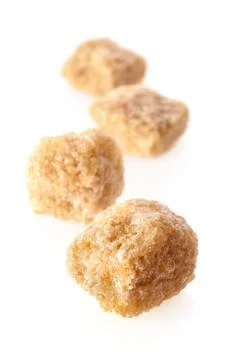 Pieces of cane sugar Stock Photos