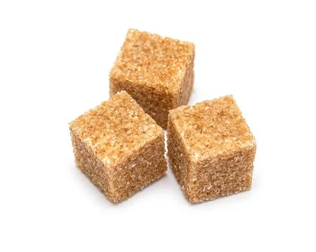Pieces of cane sugar Stock Photos