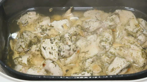 The pieces of chicken are cooked in a steamer Видео 62413402