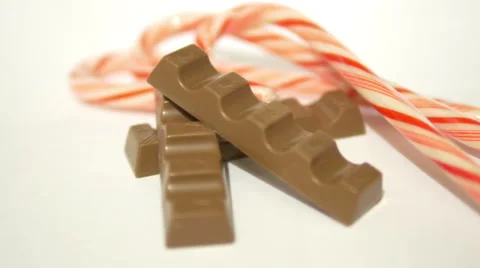 Pieces of Chocolate and Candy Canes 1 Stock Footage 45700889