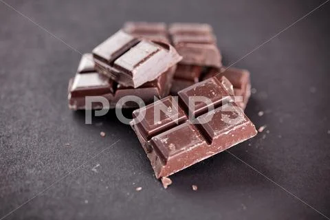 Pieces Of Chocolate On A Black Background