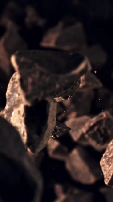 Pieces of chocolate fall down. Filmed on a high-speed camera at 1000 fps Stock Footage 335292935