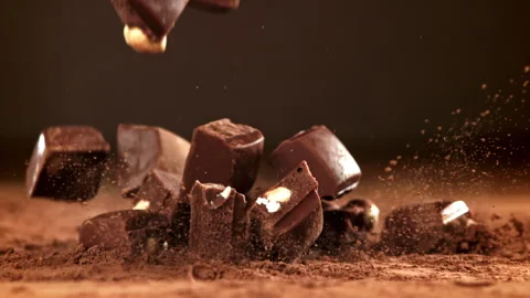 Pieces of chocolate fall on the table. Filmed on a high-speed camera at 1000 fps Stock Footage 308468221