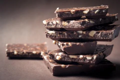 Pieces of chocolate with nuts. Stock Photos
