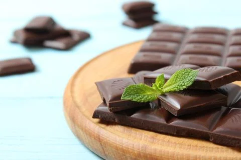 Pieces of chocolate on the table. Stock Photos