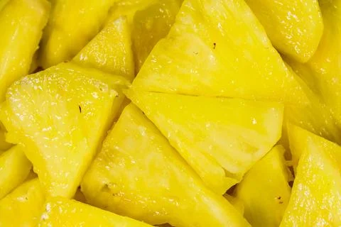 Pieces of chopped pineapple for the background Stock Photos