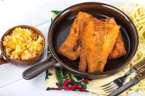 Pieces of cod in breadcrumbs. Stock Photos