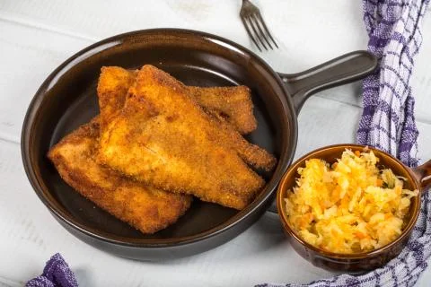Pieces of cod in breadcrumbs. Stock Photos