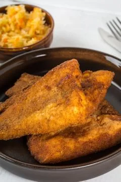 Pieces of cod in breadcrumbs. Stock Photos