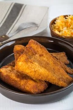 Pieces of cod in breadcrumbs. Stock Photos