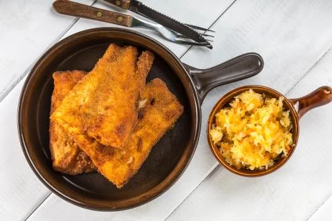 Pieces of cod in breadcrumbs. Stock Photos