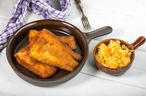 Pieces of cod in breadcrumbs. Stock Photos