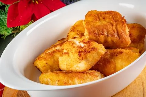 Pieces of cod fillet fried in breadcrumbs. Stock Photos