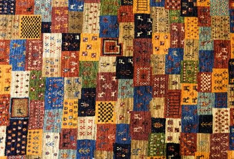 Pieces of colorful patterned carpets as backgrounds Stock Photos