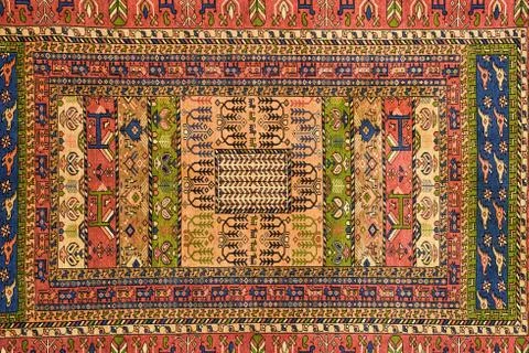Pieces of colorful patterned carpets as backgrounds Stock Photos
