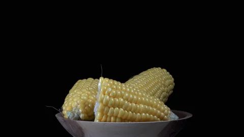 Pieces of corn on a plate rotate in 4K Stock Footage 139733101