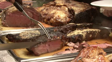 Pieces of corned beef are sliced and served at buffet Video stock 58144571