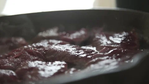 Pieces of cut beef cooking in a hot skillet Stock Footage 79791611
