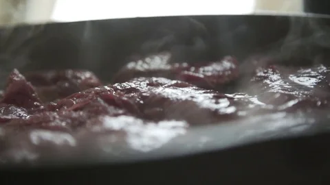 Pieces of cut beef cooking in a hot skillet Stock Footage 79791702