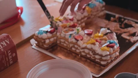 Pieces of different cakes on a baking sheet Stock Footage 197898167