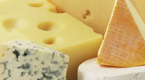 Pieces of different cheeses on plate Stock Footage 8571418