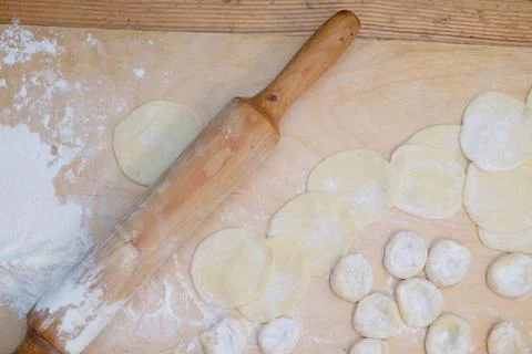 Pieces of dough on table Stock Photos