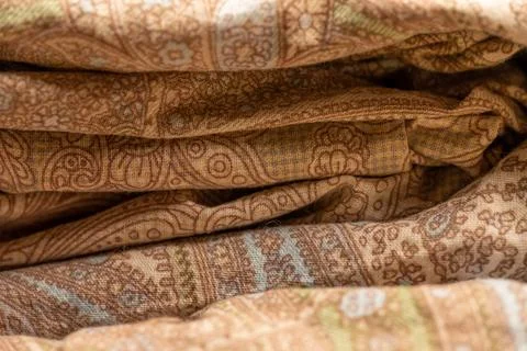 Pieces of fabric with different patterns, stacked. Close-up, selective focus Stock Photos