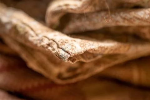 Pieces of fabric with different patterns, stacked. Close-up, selective focus Stock Photos