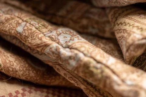 Pieces of fabric with different patterns, stacked. Close-up, selective focus Stock Photos