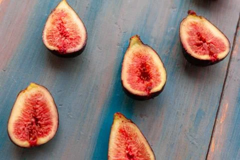 Pieces of fig on a table, ideal to recommend for some diets or meals Stock Photos