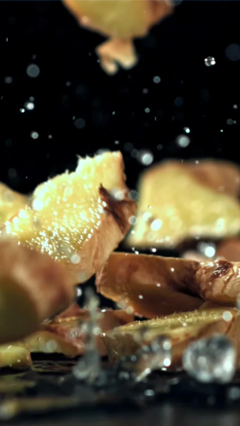 Pieces of fresh ginger fall on the table. Filmed on a high-speed camera at 1000 Stock Footage 335315390