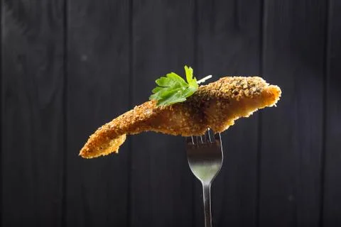 Pieces of fried Fish on a fork Stock Photos