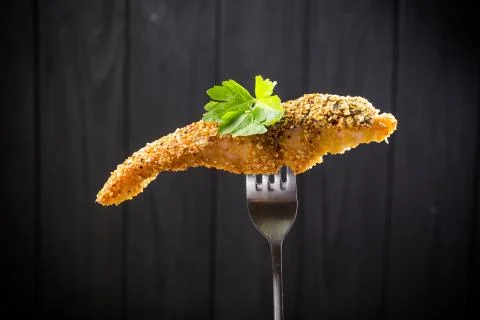Pieces of fried Fish on a fork Stock Photos