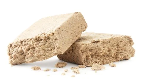 Pieces of halva on a white background. Isolated Stock Photos