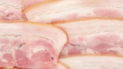Pieces of ham. Thin pieces of meat with skin. Video stock 140726033
