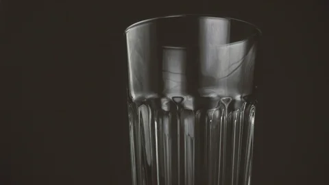 Pieces of ice fall into a glass Stock Footage 87609798