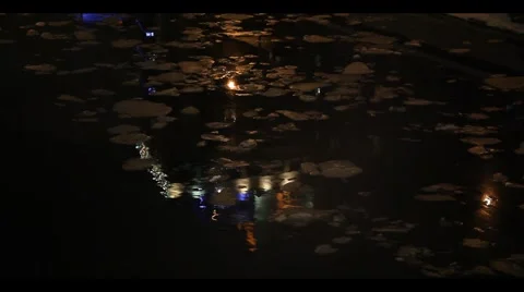 Pieces of ice float in a pool of water. night Stock Footage 1075768