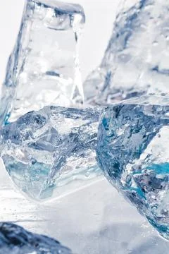 Pieces of ice on the table Stock Photos