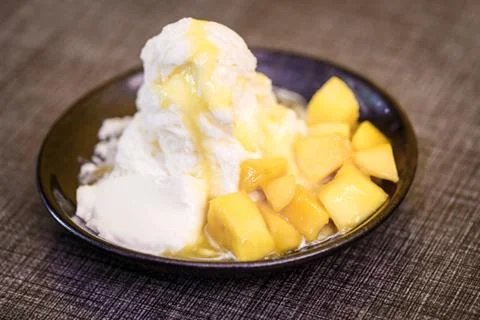 Pieces of mango and iceflake Stock Photos