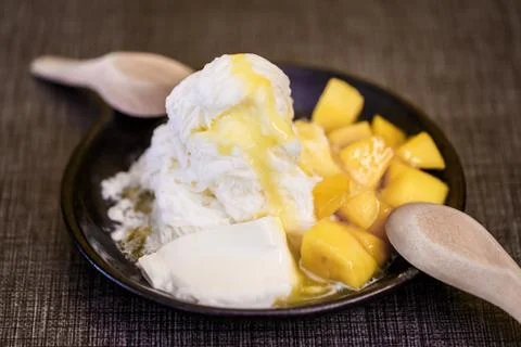 Pieces of mango and iceflake Stock Photos